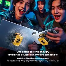 Two people holding a phone cooler with text about compatible devices.

