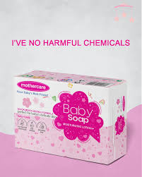 Box of baby soap with pink packaging on a light pink background


