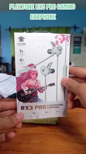 Plextone RX3 Pro gaming earphone packaging held by a person.


